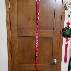 42 1/2" (total length 45 1/2") stud and grommet belt.